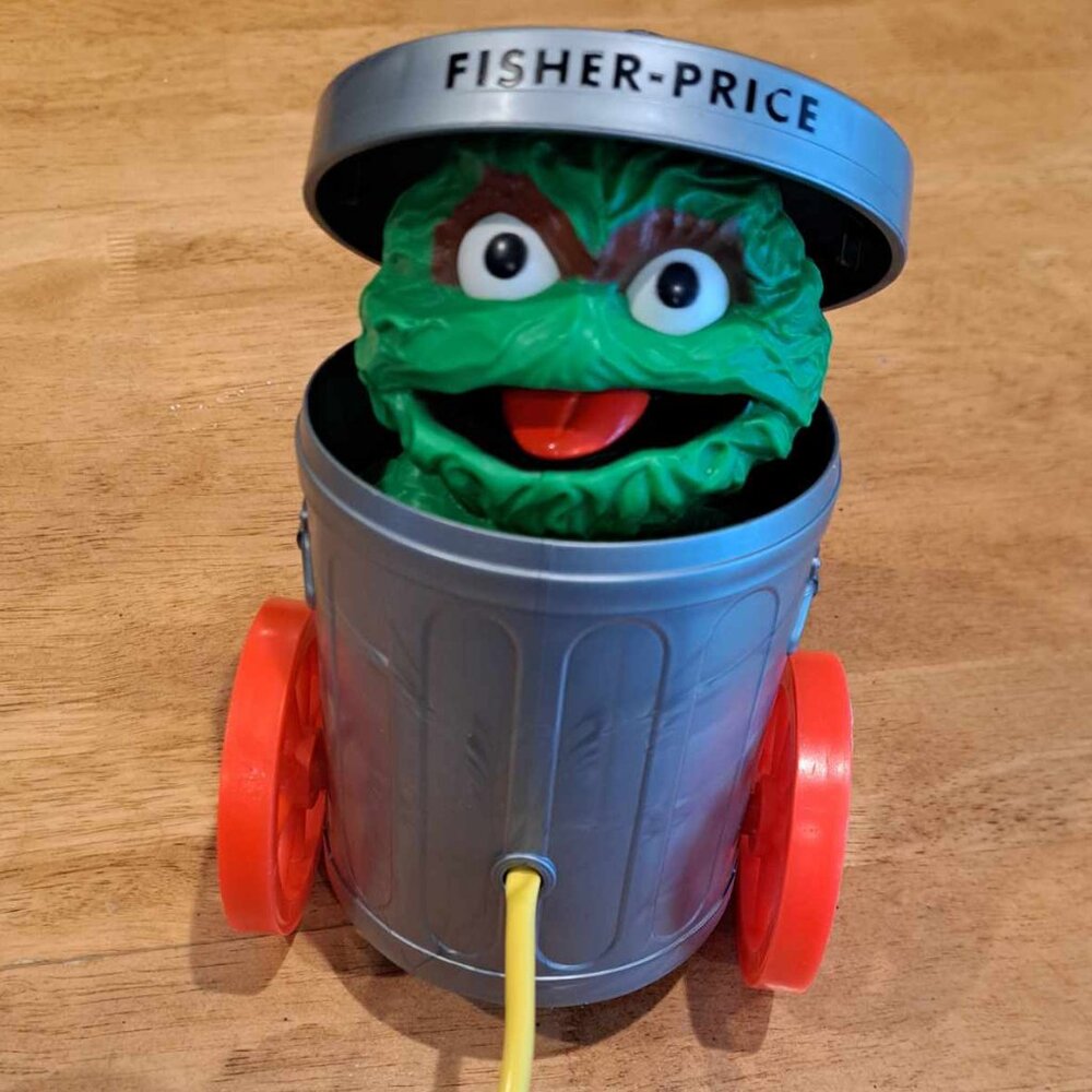 Vintage Fisher-Price 1977 Oscar the Grouch pop up pull toy